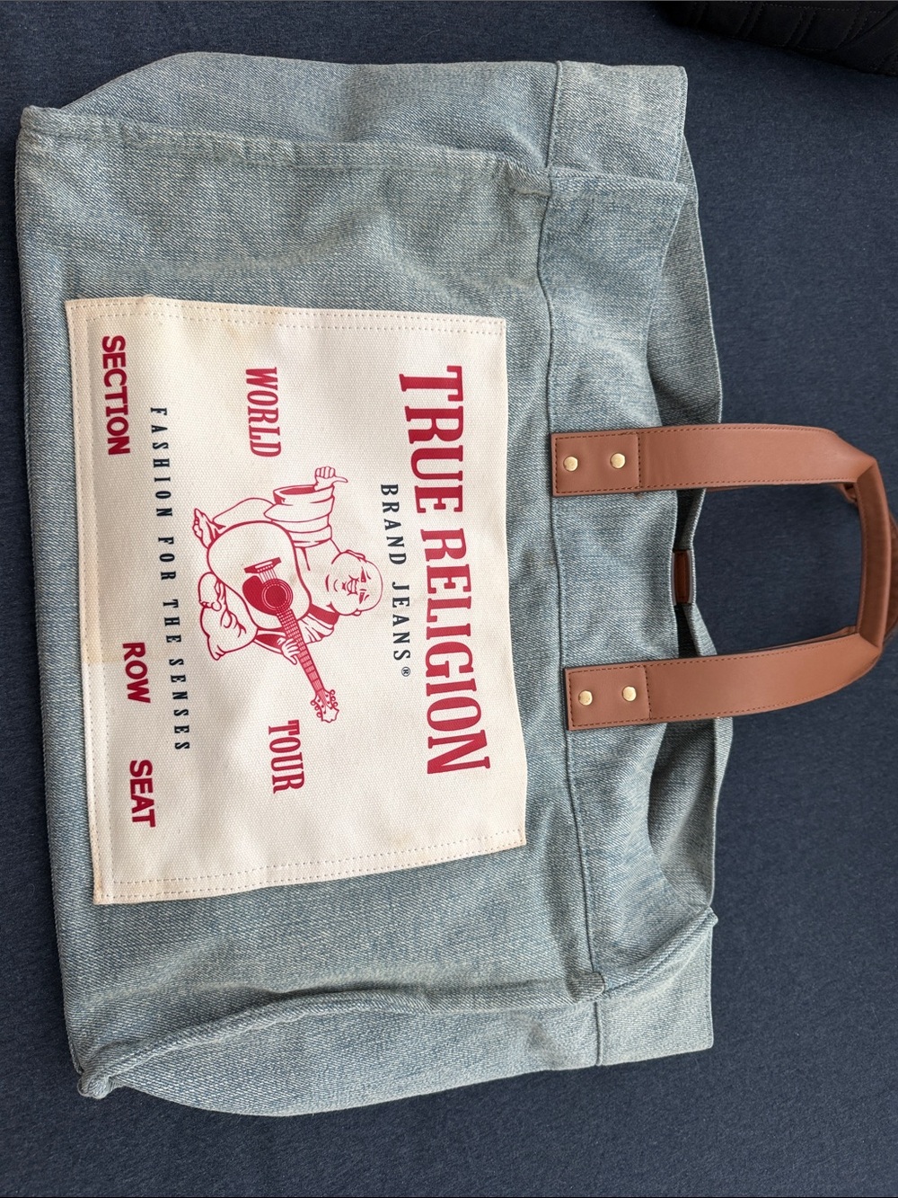 True Religion Light Blue Canvas Tote with Tan Handles and Red Front Graphic